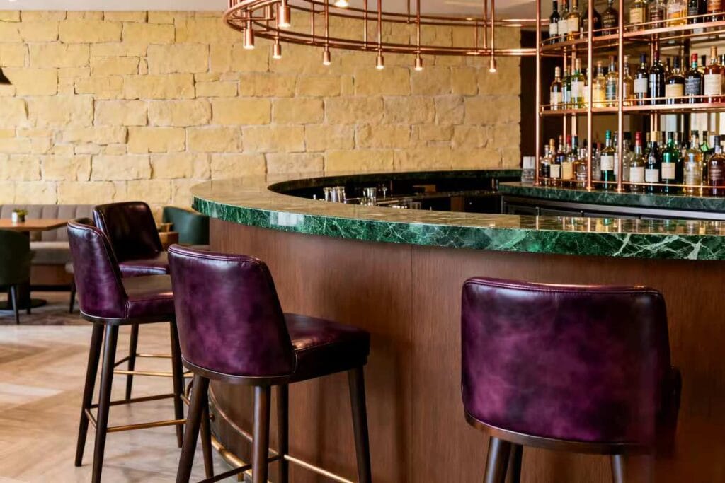 Hotel Furniture Trends--Combination of warm earth tones + dark accent colors